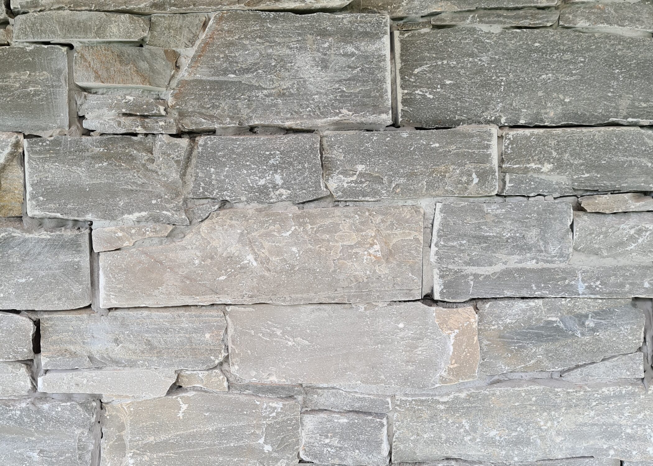 Decarock Cladding is an alternative to traditional stone walling, and consists of pieces of natural stone held together with small amounts of resin and a mesh