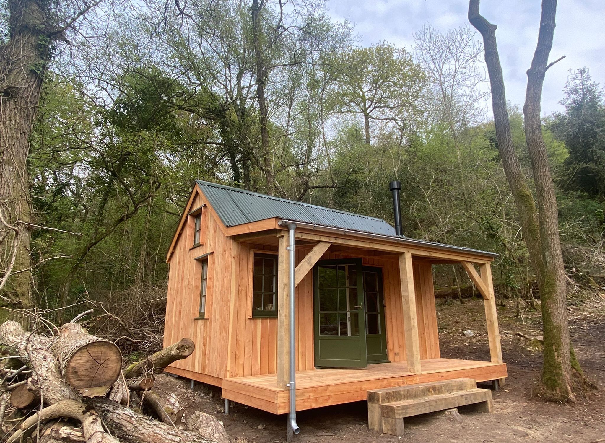 Larch clad, oak frame porch woodland cabin _ Life Space Cabins