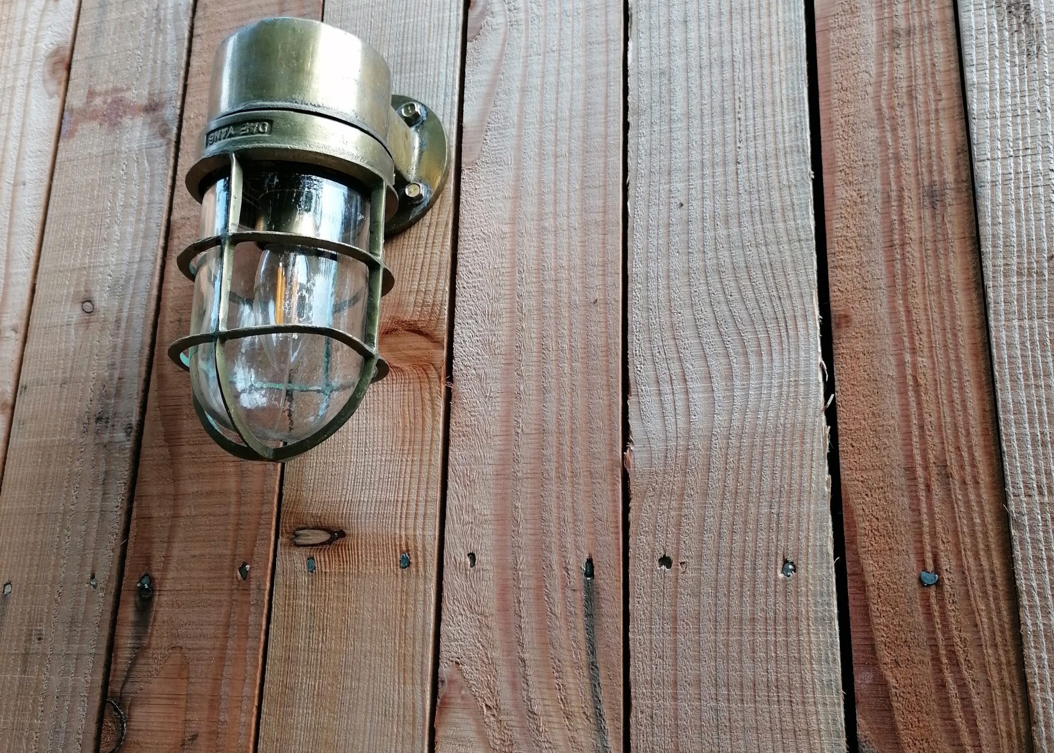 Reclaimed Brass light fitting from Trinity Marine fitted to Life Space Cabin