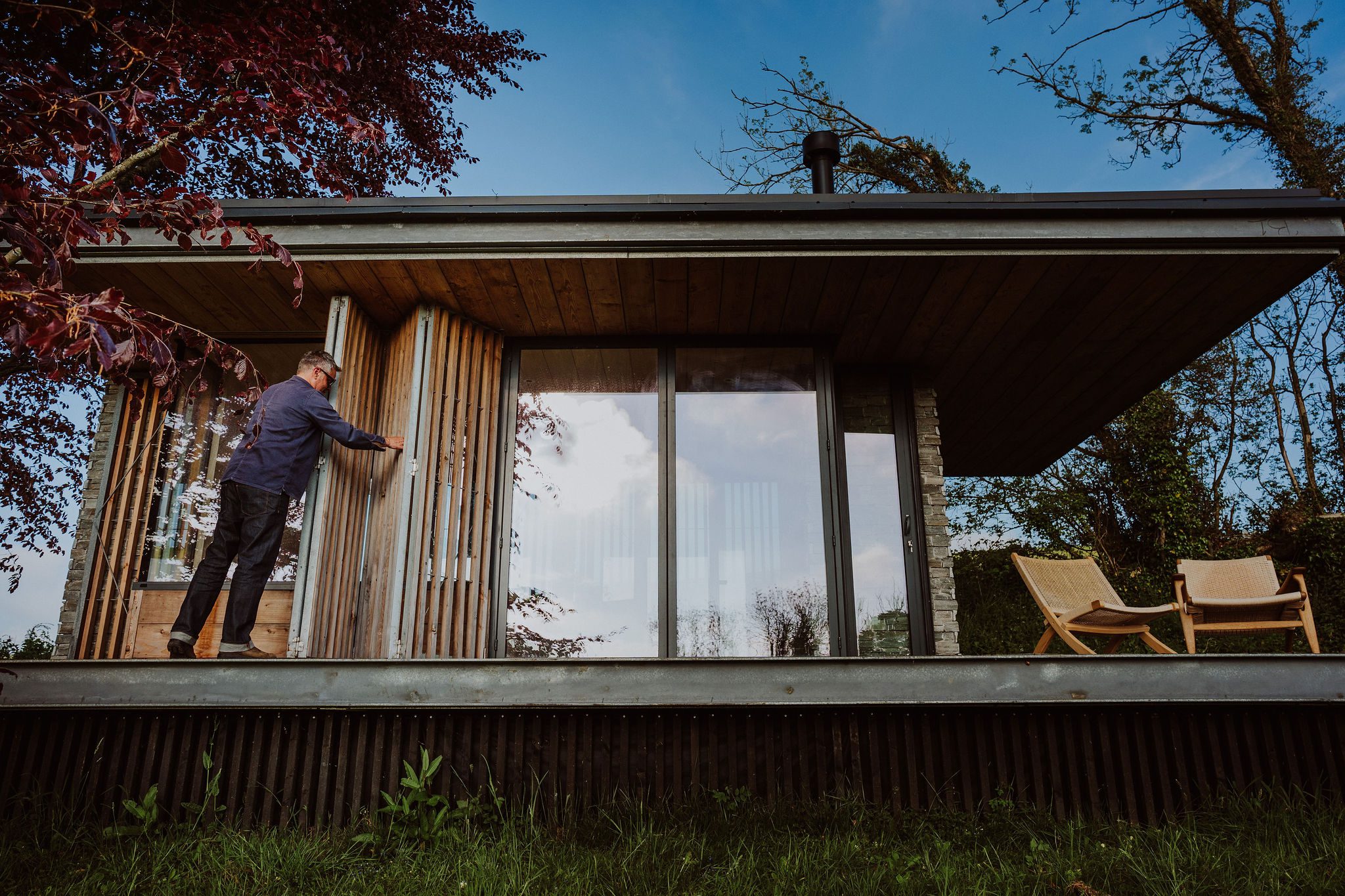 modern-cabin-folding-shutters-timber-steel