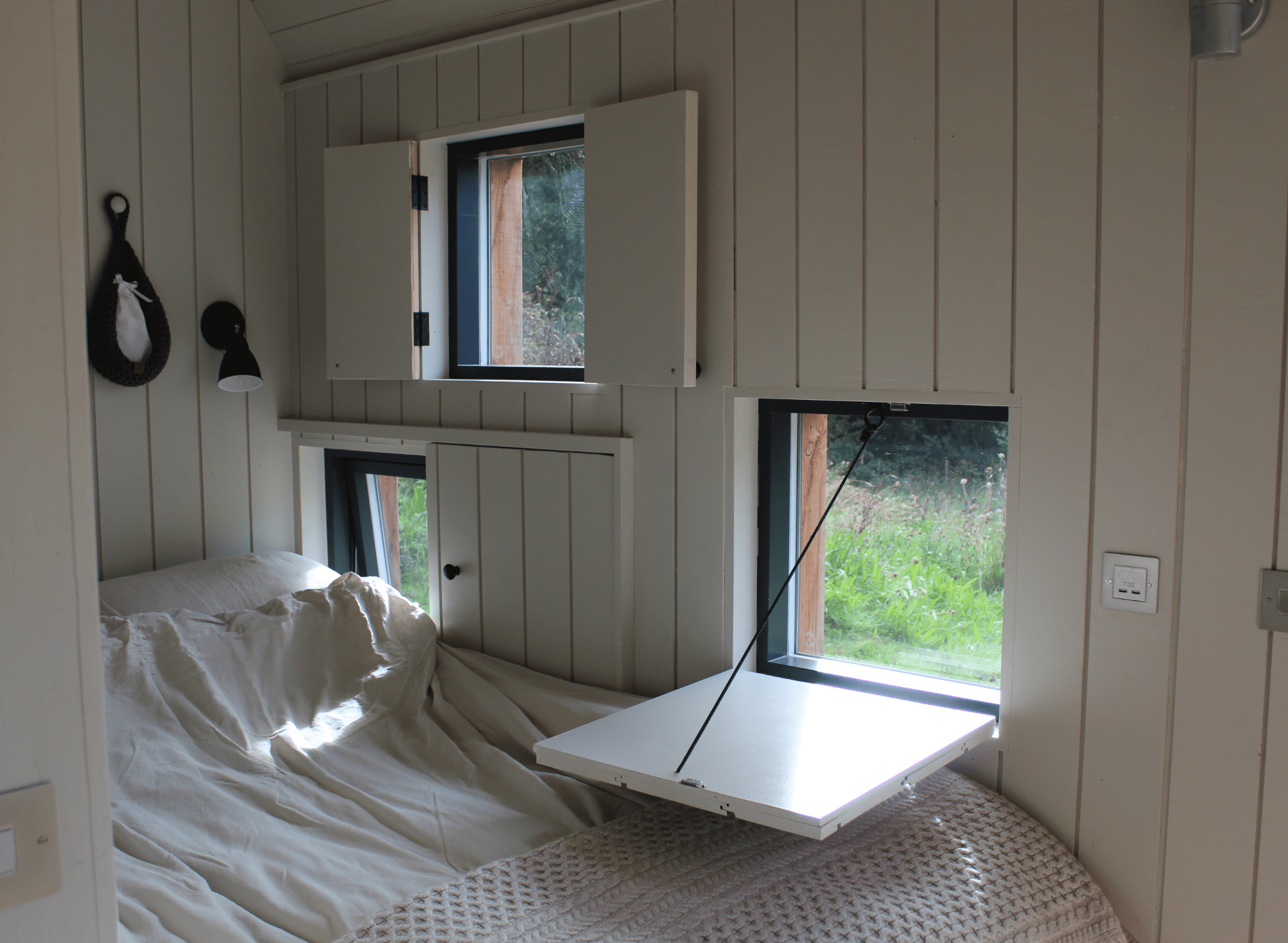 Bespoke Holiday cabin rental. Bespoke peekaboo shutters for this Dart cabin. Design and build by Life Space Cabins